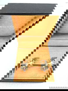 Bvlgari 18K Yellow White Gold Cuff Earrings 30.70g Original Box: Bvlgari 18K Yellow White Gold Cuff Earrings 30.70g Original Box Discover the elegance of this stunning pair of Bvlgari earrings, crafted in luxurious 18K yellow and white gold. Each earring