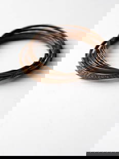 1970s Vintage Copper Entwined Bangle Bracelet Set 2.75" Diameter: 1970s Vintage Copper Entwined Bangle Bracelet Set 2.75" Diameter Discover this exquisite set of vintage 1970s copper entwined bangles, a stylish addition to any jewelry collection. This unique bracele
