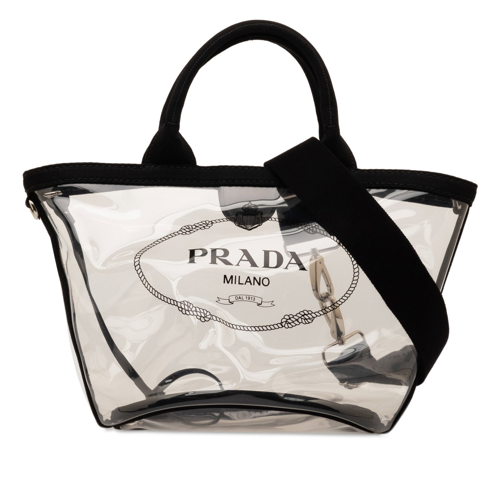 Prada Canapa Trimmed Plex Logo Tote Black PVC with Zip Pouch: Prada Canapa Trimmed Plex Logo Tote Black PVC with Zip Pouch Introducing the Prada Canapa Trimmed Plex Logo Tote, a stylish and functional bag crafted with a transparent PVC body. This versatile tote 