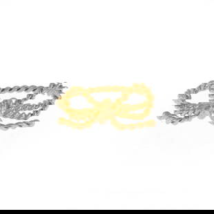 Tiffany & Co. 18k Yellow Gold Bow Ring Twisted Cable Design: Tiffany & Co. 18k Yellow Gold Bow Ring Twisted Cable Design This exquisite ring from Tiffany & Co. is crafted in 18k yellow gold with a fine polished finish. The design features a delightful bow made