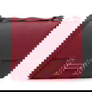 Epsom Leather Constance 24 Crossbody Bag: Epsom Leather Constance 24 Crossbody Bag The Hermes Epsom Constance 24 crossbody bag features an Epsom leather body, a flat leather shoulder strap, a front flap with H buckle closure, and interior zip