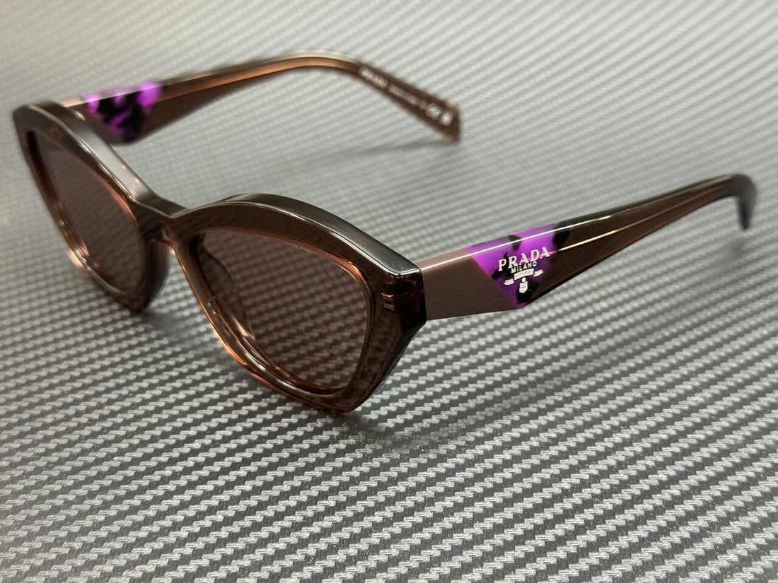 PRADA Women's Brown Transparent Sunglasses 52mm PR A02S: PRADA Women's Brown Transparent Sunglasses 52mm PR A02S Elevate your style with these stunning PRADA sunglasses, featuring a chic brown transparent frame that exudes sophistication. Designed specifica