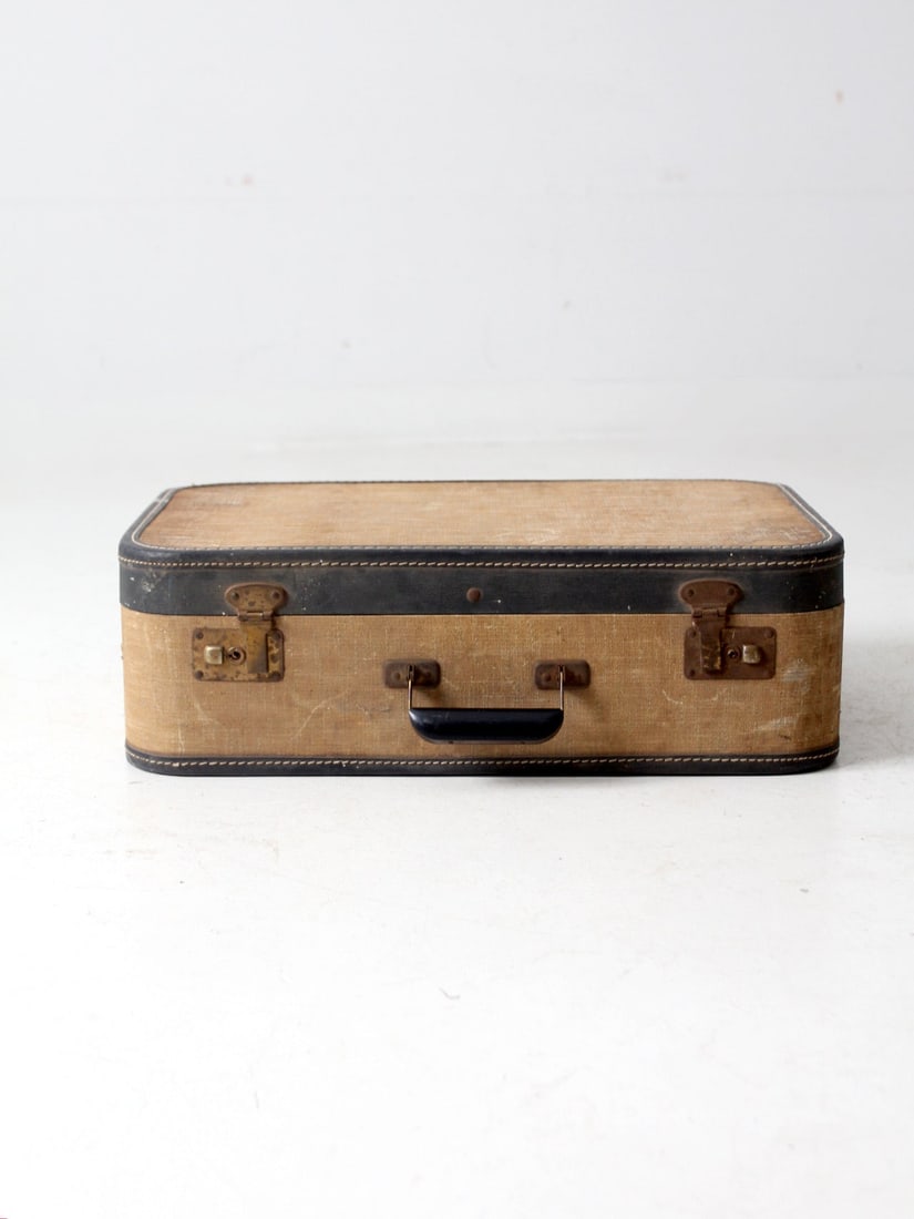 Vintage Tan Tweed Hardshell Suitcase with Black Leather Trim: Vintage Tan Tweed Hardshell Suitcase with Black Leather Trim This vintage tweed hardshell suitcase combines classic style with functionality. The suitcase features a sturdy tan tweed exterior compleme