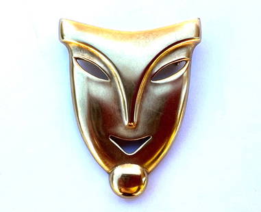 Exquisite French Art Deco 18K Yellow Gold Mask Brooch: Exquisite French Art Deco 18K Yellow Gold Mask Brooch This exquisite French Art Deco brooch is crafted from 18K yellow gold, showcasing a polished and sleek mask design. Weighing 28.90 grams, it measu