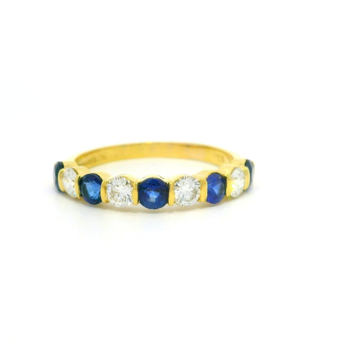 Tiffany & Co. 18k Gold Sapphire Diamond Band Ring 1.25ct: Tiffany & Co. 18k Gold Sapphire Diamond Band Ring 1.25ct This exquisite Tiffany & Co. band ring features a stunning arrangement of sapphires and diamonds. Crafted from luxurious 18k yellow gold, the r