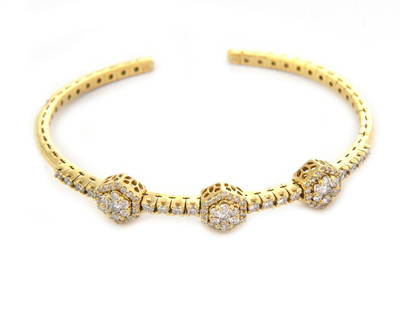 Elegant 18kt Yellow Gold Diamond Cuff Bracelet 3 Station Design: Elegant 18kt Yellow Gold Diamond Cuff Bracelet 3 Station Design This elegant cuff bracelet features a slim flex band crafted from 18k yellow gold with a polished finish. The design showcases three oct