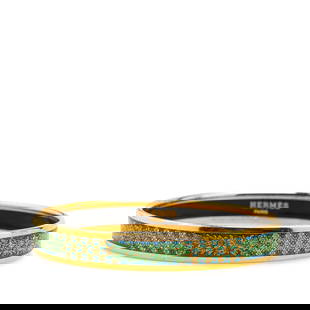 Hermes Narrow Cloisonne Enamel Bangle 65 Green Gold Plated: Hermes Narrow Cloisonne Enamel Bangle 65 Green Gold Plated This exquisite Hermes Narrow Cloisonne Enamel Bangle showcases a vibrant green printed enamel design with a luxurious gold-plated body. Craft