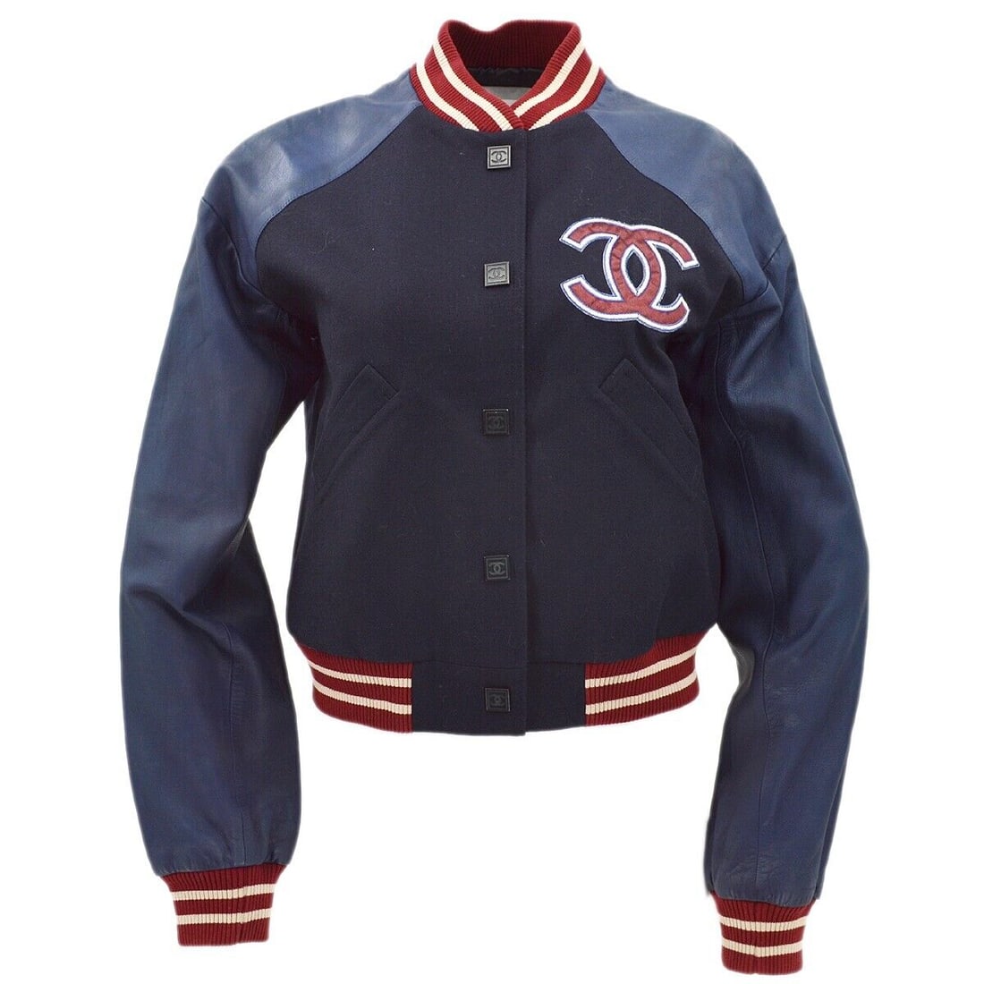 Chanel Navy Vintage Spring Bomber Jacket 100% Wool Size 40: Chanel Navy Vintage Spring Bomber Jacket 100% Wool Size 40 Elevate your casual style with this vintage Chanel Spring Letterman Bomber Jacket in a classic navy hue. Crafted from 100% wool, this mid-len