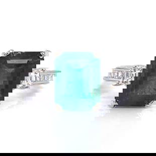 Stunning 18K White Gold Emerald 4.12 Ct and Diamond Ring: Stunning 18K White Gold Emerald 4.12 Ct and Diamond Ring This exquisite ring features a stunning 4.12 Ct. emerald, beautifully complemented by 18 diamonds totaling approximately 0.70 Ct. The