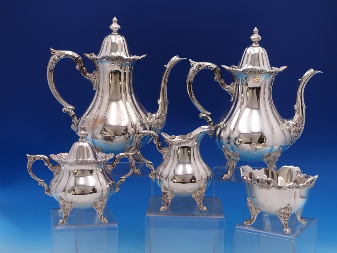 Wallace Rose Point Silverplate 5-Piece Tea Set #1200: Wallace Rose Point Silverplate 5-Piece Tea Set #1200 Enhance your tea time with this exquisite 5-piece Rose Point tea set by Wallace, crafted from silverplate. This elegant set features a coffee pot, 