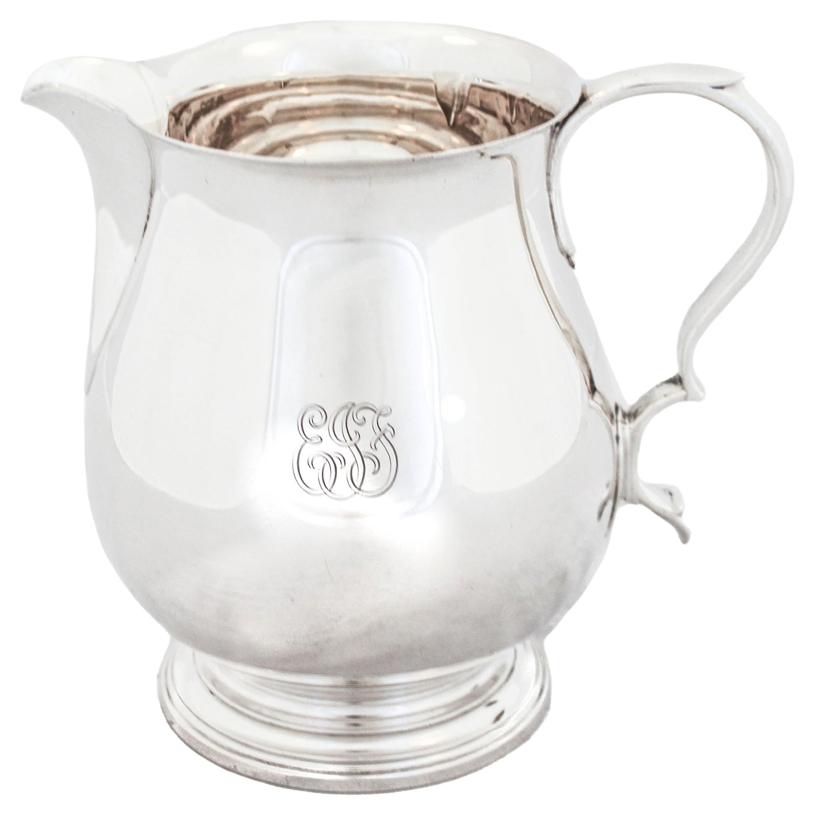 Sterling Silver Water Pitcher: Sterling Silver Water Pitcher This exquisite sterling silver water pitcher, crafted by the esteemed Tiffany & Co., showcases a classic federalist design. Hallmarked from 1921, this piece measures 8 in