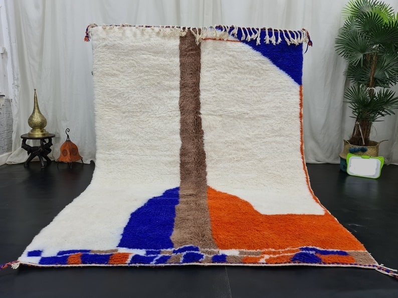 Handwoven Moroccan Berber Wool Rug 9.84 x 6.56 Feet: Handwoven Moroccan Berber Wool Rug 9.84 x 6.56 Feet Discover the beauty of this elegant, handwoven Moroccan Berber wool rug, crafted in the Atlas Mountains by skilled local Berber women using traditio