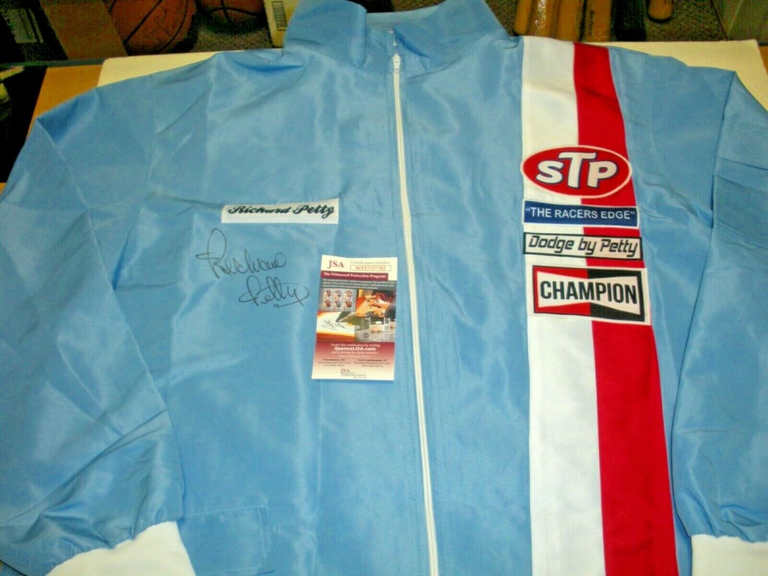 Richard Petty NASCAR Champion Blue Racing Jacket JSA COA: Richard Petty NASCAR Champion Blue Racing Jacket JSA COA This authentic Richard Petty NASCAR Champion jacket features a striking blue design, perfect for fans of racing. This original piece is pre-own
