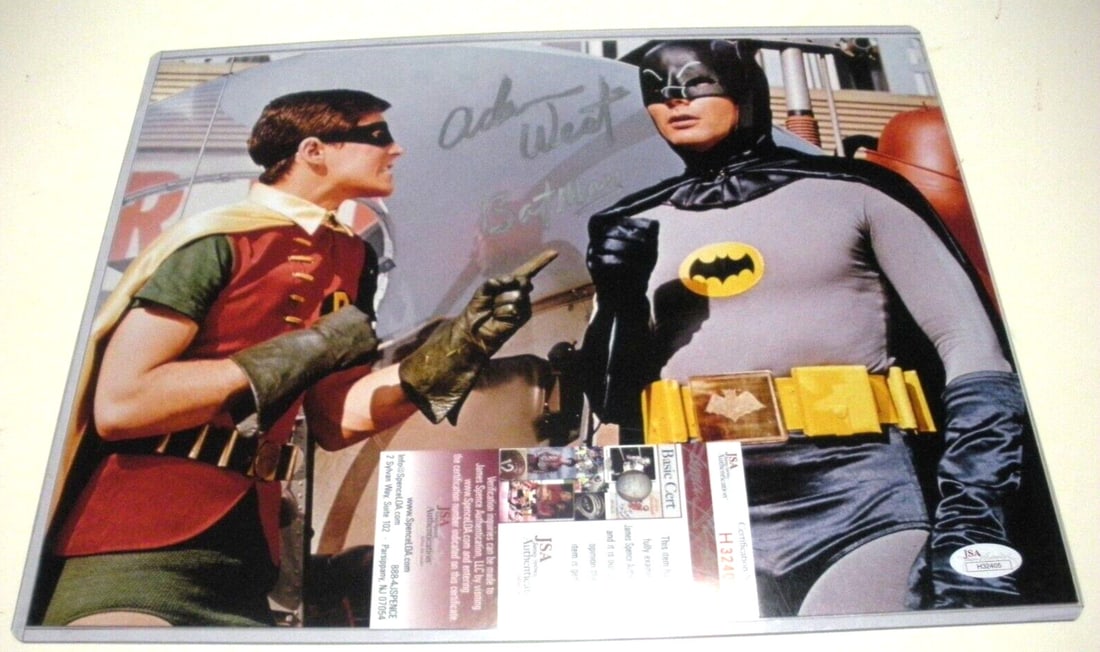 Adam West Signed 11x14 Batman Photo with JSA COA: Adam West Signed 11x14 Batman Photo with JSA COA This is an original 11x14 photograph signed by Adam West, the iconic actor known for his portrayal of Batman. The item is pre-owned and comes with a JS
