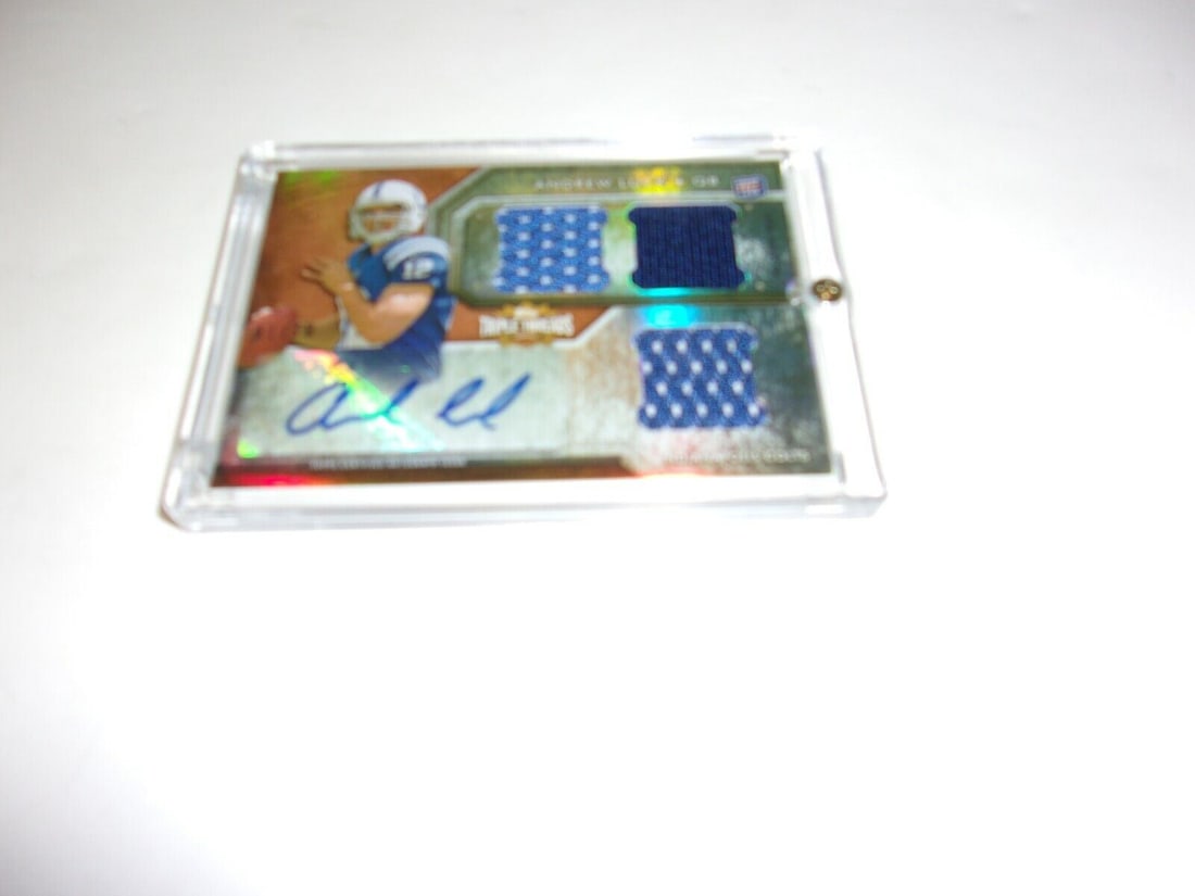 Andrew Luck 2012 Topps Game Used Triple Jersey Auto 41/70 Card: Andrew Luck 2012 Topps Game Used Triple Jersey Auto 41/70 Card This collectible card features Andrew Luck, a prominent NFL quarterback, showcasing a game-used triple jersey. It is a limited edition it