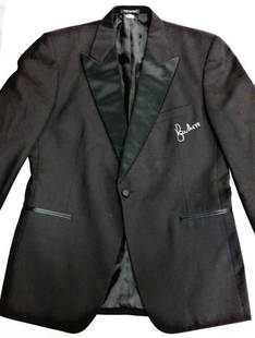 Roger Moore Signed James Bond Tuxedo Blazer with Beckett COA: Roger Moore Signed James Bond Tuxedo Blazer with Beckett COA This authentic tuxedo jacket blazer, famously associated with James Bond, is signed by the iconic actor Roger Moore. This unique piece is a