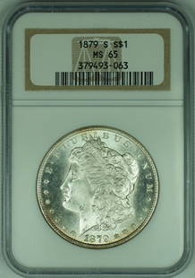 1879-S Morgan Silver Dollar NGC MS 65 Uncirculated Silver Coin: 1879-S Morgan Silver Dollar NGC MS 65 Uncirculated Silver Coin This 1879-S Morgan Silver Dollar is a stunning representation of American coinage, featuring the iconic Morgan design. The coin is compos