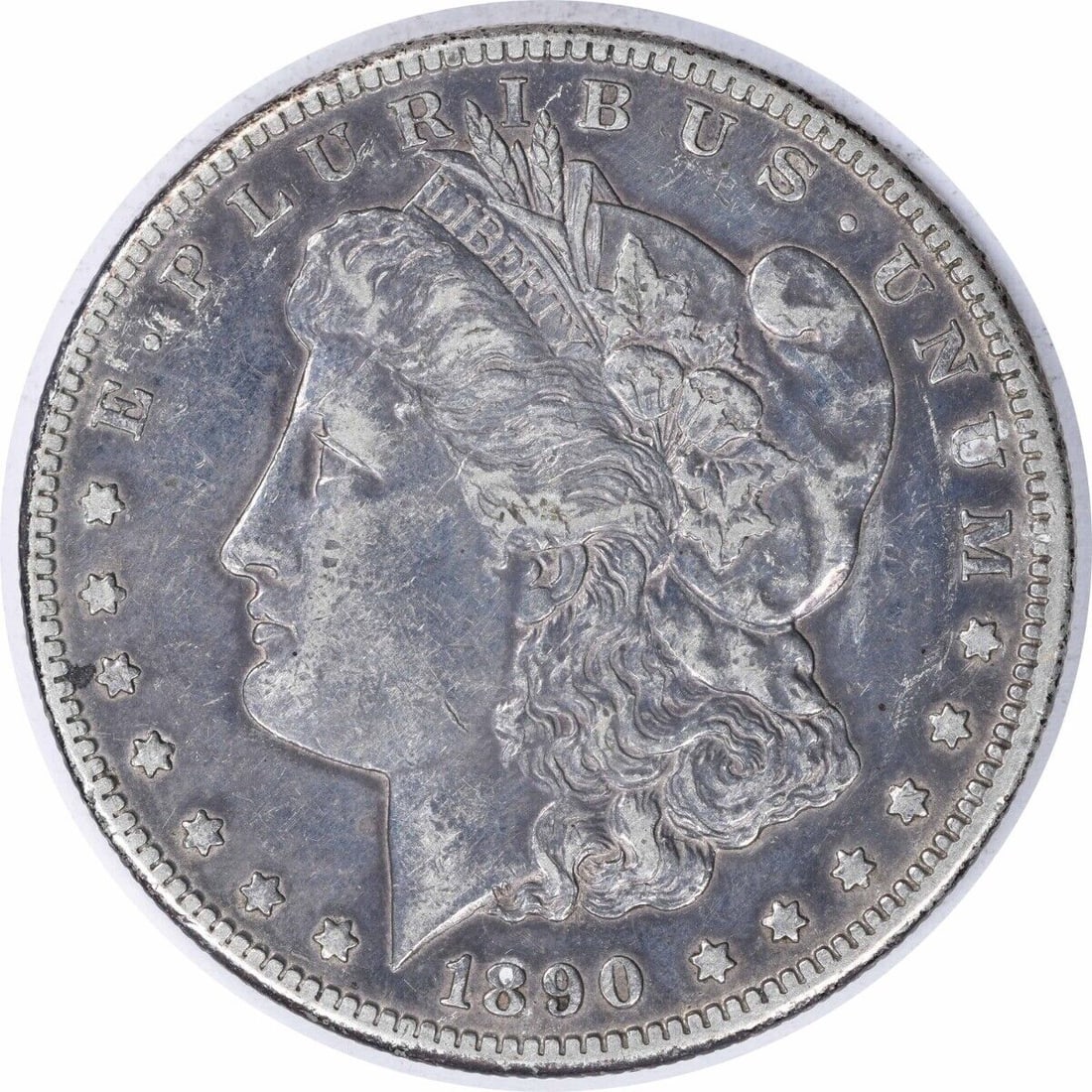 1890-CC Morgan Silver Dollar XF Uncertified 90% Silver Coin: 1890-CC Morgan Silver Dollar XF Uncertified 90% Silver Coin This 1890-CC Morgan Silver Dollar showcases the artistry of designer George T. Morgan. It is a circulated coin in Extra Fine (XF) condition,