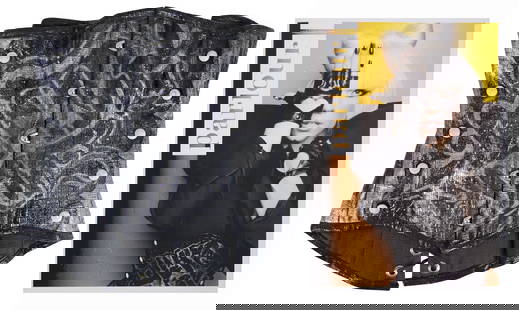 Lady Gaga Worn Faux Snakeskin Corset with Graffiti Art: Lady Gaga Worn Faux Snakeskin Corset with Graffiti Art This striking black and silver faux snakeskin corset features graffiti-style art, famously worn by Lady Gaga on the cover and within the pages of