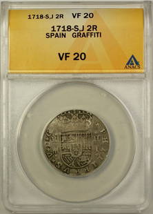 1718-S Spain 2 Reales Silver Coin ANACS VF 20 Graffiti Segovia: 1718-S Spain 2 Reales Silver Coin ANACS VF 20 Graffiti Segovia This 1718-S 2 Reales Silver Coin from Spain showcases an impressive VF 20 grade, certified by ANACS. The coin is made of silver and exhib