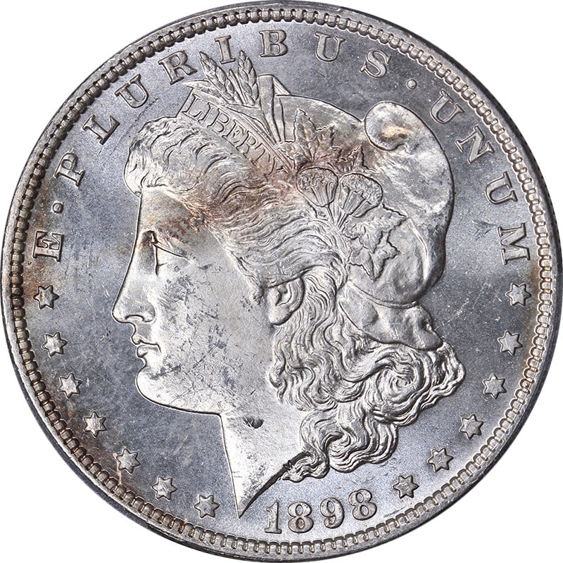 1898-P Morgan Silver Dollar PCGS MS64 Uncirculated Strong Strike: 1898-P Morgan Silver Dollar PCGS MS64 Uncirculated Strong Strike This 1898-P Morgan Silver Dollar is certified by PCGS with a grade of MS64, reflecting its uncirculated condition and nice eye appeal. 