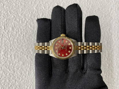 Rolex Datejust Ladies Red Dial Jubilee Ref 69173 YG-SS: Rolex Datejust Ladies Red Dial Jubilee Ref 69173 YG-SS This exquisite Rolex Datejust features a striking red dial, elegantly complemented by a fluted bezel and a classic Jubilee bracelet. Designed spe