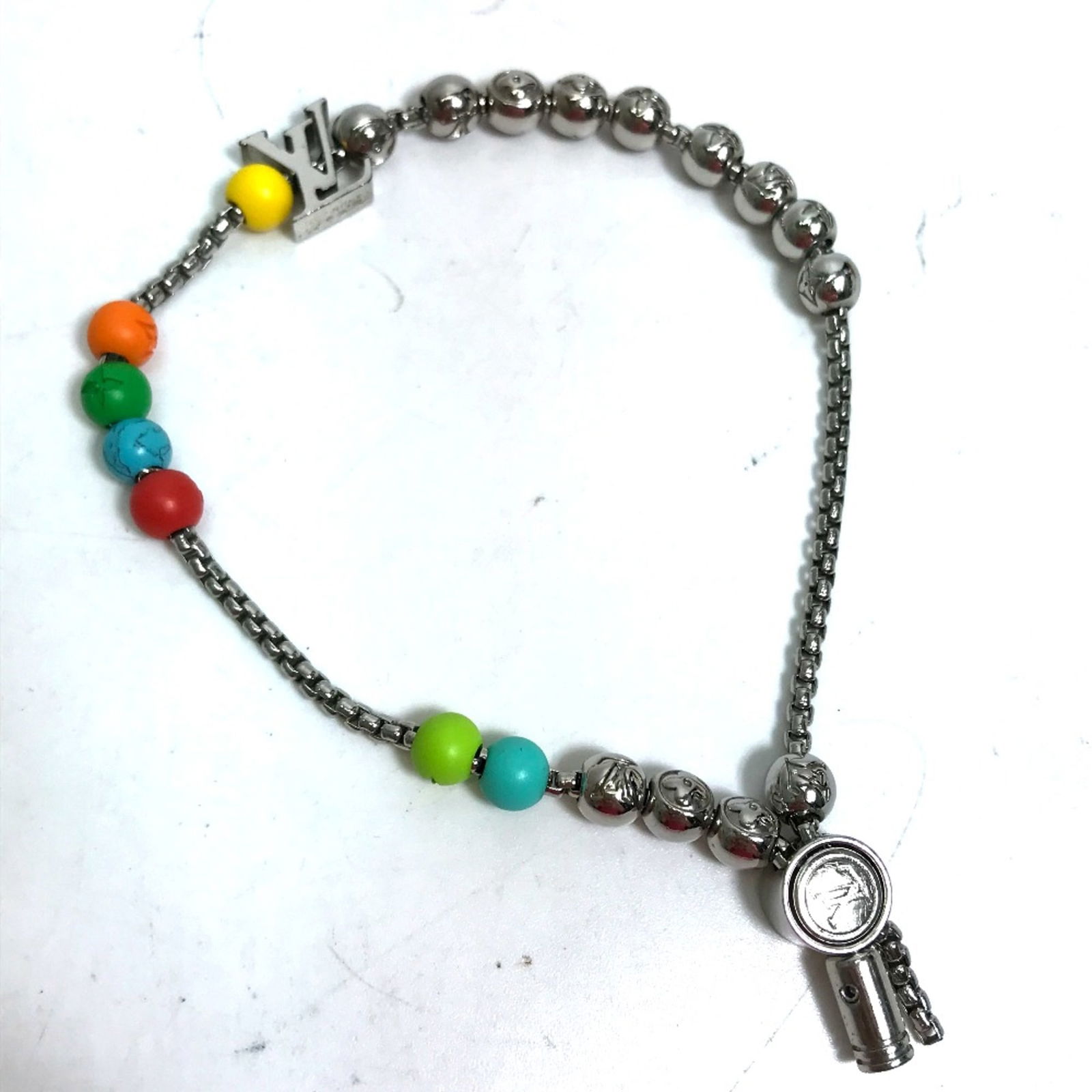 Louis Vuitton M0934A Multicolore Chain Bracelet Adjustable for Men: Louis Vuitton M0934A Multicolore Chain Bracelet Adjustable for Men Elevate your accessory game with this stylish Louis Vuitton Chain Accessories Bracelet. Designed for men, this bracelet features an a