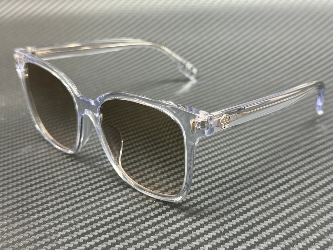 Tory Burch TY7203U Women's 53mm Clear Brown Gradient Sunglasses: Tory Burch TY7203U Women's 53mm Clear Brown Gradient Sunglasses Elevate your accessory collection with these Tory Burch TY7203U sunglasses, featuring a stylish clear frame complemented by a chic brown