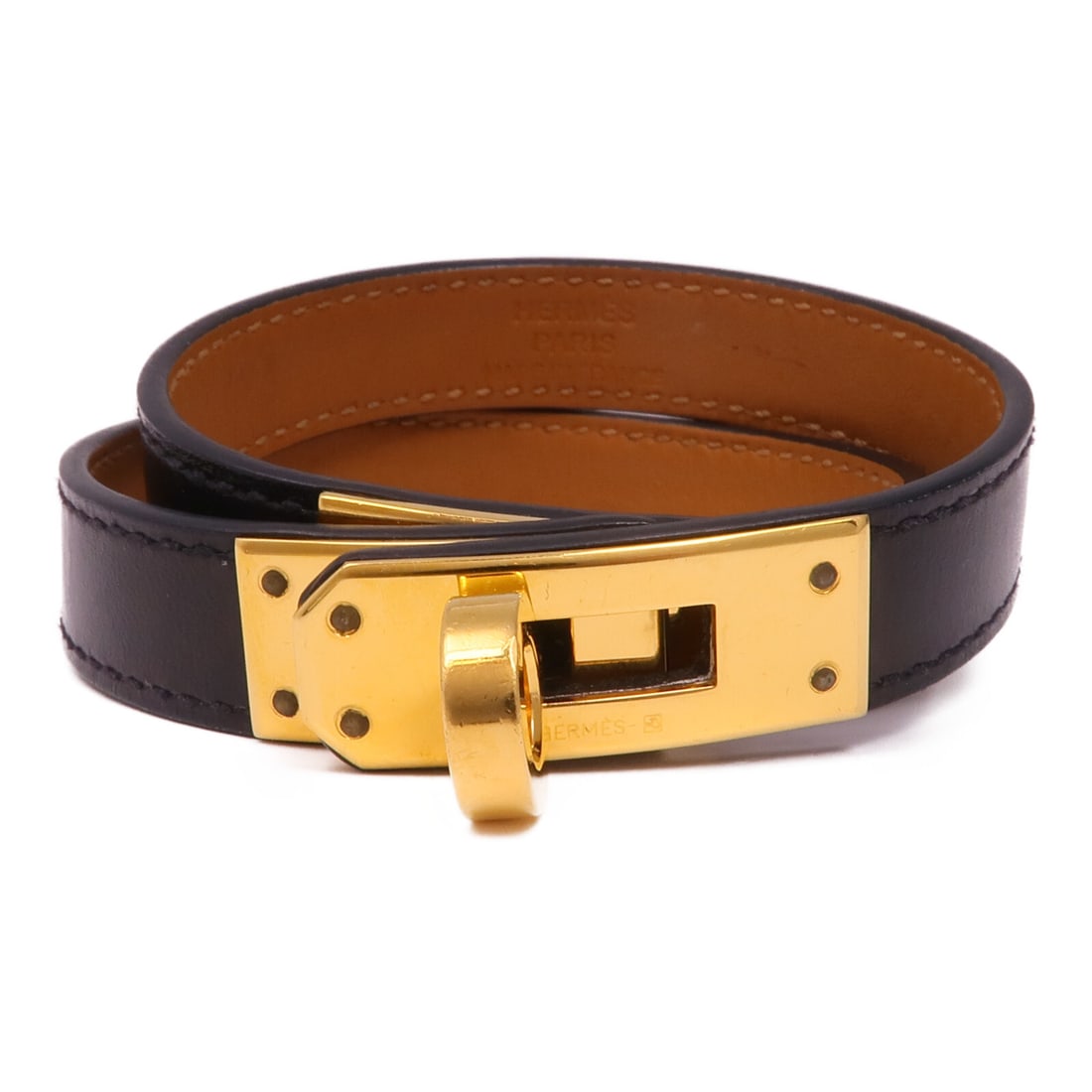 HERMES Kelly Double Tour Bracelet Black Calfskin Leather: HERMES Kelly Double Tour Bracelet Black Calfskin Leather This exquisite HERMES Kelly Double Tour Bracelet is crafted from high-quality calfskin (cowhide), showcasing a sleek black color that complemen
