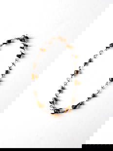 Vintage Gold Tone Amber Beaded Necklace 17.5 Inch: Vintage Gold Tone Amber Beaded Necklace 17.5 Inch This vintage beaded necklace features a stylish design with gold tone wire wrapped amber beads. The necklace is secured with a simple hook closure, ma