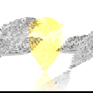 GIA Certified 4.73ct Fancy Yellow Pear Cut Diamond Ring in 18K White Gold: GIA Certified 4.73ct Fancy Yellow Pear Cut Diamond Ring in 18K White Gold This exquisite 4.73-carat Fancy Yellow Pear Cut Diamond Engagement Ring is designed to dazzle and enchant. Crafted from luxuri