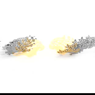 Carrera y Carrera 18k Gold Diamond Ruby Eagle Headdress Earrings: Carrera y Carrera 18k Gold Diamond Ruby Eagle Headdress Earrings This exquisite pair of earrings by Carrera y Carrera features a woman's face adorned with an intricate eagle headdress. Crafted from lu