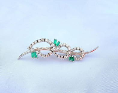 1960s French Platinum Diamond Emerald Brooch 900 Purity: 1960s French Platinum Diamond Emerald Brooch 900 Purity Discover this exquisite 1960's French brooch, crafted from 900 platinum and adorned with stunning diamonds and emeralds. This unbranded piece fe