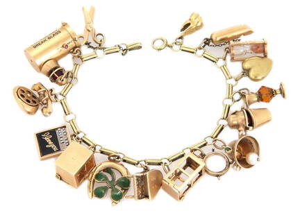 14k Yellow Gold Charm Bracelet with 17 Assorted Collectible Charms: 14k Yellow Gold Charm Bracelet with 17 Assorted Collectible Charms This exquisite vintage charm bracelet is expertly crafted from 14k yellow gold, featuring an elegant combination of round and long sh