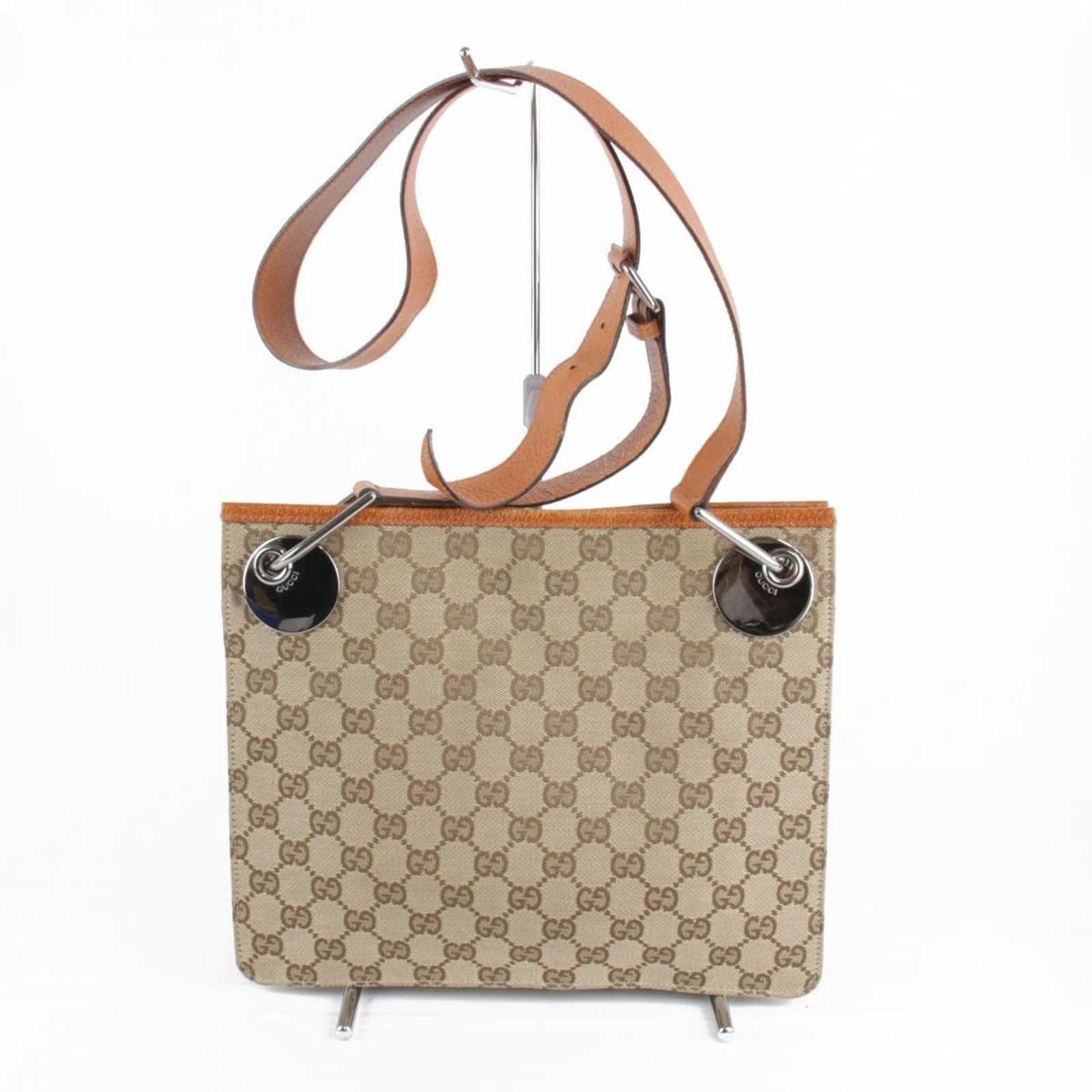 Gucci 120841 200047 Beige GG Canvas Shoulder Bag for Women: Gucci 120841 200047 Beige GG Canvas Shoulder Bag for Women This elegant Gucci shoulder bag is crafted from durable GG canvas in a sophisticated beige hue, making it a stylish accessory for any outfit.
