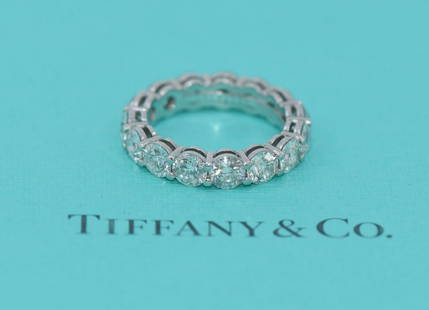 Tiffany & Co Platinum Diamond Eternity Band Ring 5.87 CTW Size 8 VVS1: Tiffany & Co Platinum Diamond Eternity Band Ring 5.87 CTW Size 8 VVS1 This exquisite Tiffany & Co. platinum eternity band ring showcases 15 stunning diamonds totaling 5.87 carats. Featuring a diamond