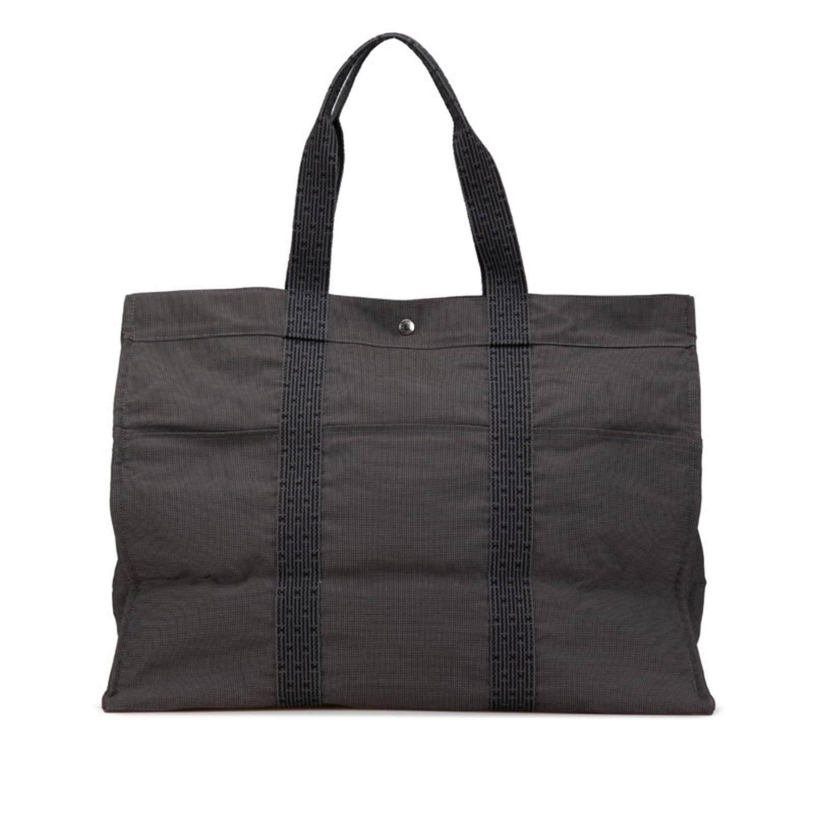 Hermes Air Line TGM Grey Canvas Tote Bag 43cm x 56cm x 26cm: Hermes Air Line TGM Grey Canvas Tote Bag 43cm x 56cm x 26cm This elegant Hermes Air Line TGM Tote Bag is crafted from durable gray canvas, making it a stylish yet practical choice for women on the go.