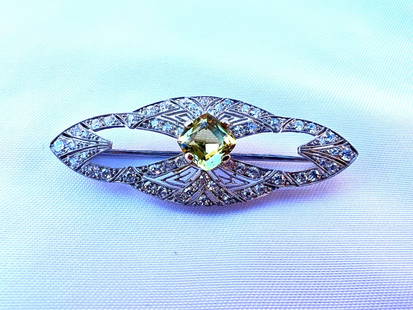 French Art Deco Platinum Diamond Chrysoberyl Brooch with DGA Certificate: French Art Deco Platinum Diamond Chrysoberyl Brooch with DGA Certificate Presenting a stunning French Art Deco brooch crafted from platinum, featuring a mesmerizing diamond chrysoberyl at its center.