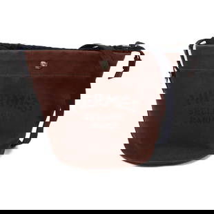 HERMES Brown Canvas Shoulder Bag PHW Bolso De Aseo: HERMES Brown Canvas Shoulder Bag PHW Bolso De Aseo A stylish shoulder bag by HERMES, crafted from durable brown canvas. This bag features dimensions of 8.3 in height, 8.7 in depth, and 9.1 in length,