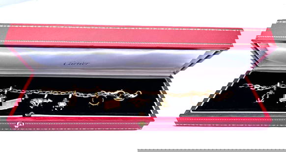 Authentic Cartier 18K Gold Charm Bracelet with 7 Signed Charms: Authentic Cartier 18K Gold Charm Bracelet with 7 Signed Charms Discover the elegance of this authentic French Cartier charm bracelet, crafted from luxurious 18k yellow gold. This exquisite piece featu