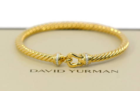 David Yurman Cablespira 18K Yellow Gold Diamond Bangle Bracelet: David Yurman Cablespira 18K Yellow Gold Diamond Bangle Bracelet This exquisite David Yurman Cablespira bracelet features a stunning combination of 18k yellow gold and sparkling diamonds. Crafted in a