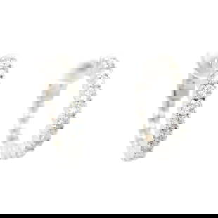 Elegant 14k White Gold 0.92ctw Diamond Hoop Earrings: Elegant 14k White Gold 0.92ctw Diamond Hoop Earrings Elevate your style with these elegant 14k white gold medium hoop earrings featuring a total diamond weight of 0.92 carats. Each earring showcases b