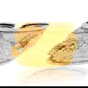 David Webb 18K Yellow Gold Leopard Cuff Bracelet with Emerald Eyes: David Webb 18K Yellow Gold Leopard Cuff Bracelet with Emerald Eyes This exquisite David Webb bracelet is a stunning piece from the Kingdom Collection, featuring a repousse leopard design. Crafted in 1