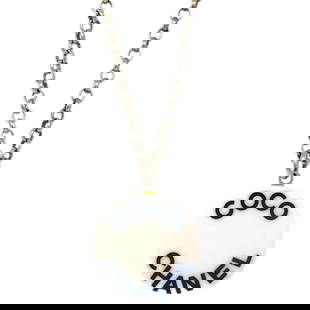 Chanel Gold-Plated Round Charm Pendant Necklace 07P: Chanel Gold-Plated Round Charm Pendant Necklace 07P This exquisite Chanel pendant necklace features a round charm design, elegantly crafted in a stunning gold-plated finish. The necklace embodies the