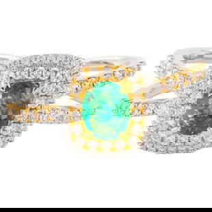 1.05ctt Emerald and Diamond Halo Ring in 14k White & Yellow Gold: 1.05ctt Emerald and Diamond Halo Ring in 14k White & Yellow Gold This stunning 1.05ctt emerald and diamond ring showcases a captivating halo design crafted from 14k white and yellow gold. The ring fea