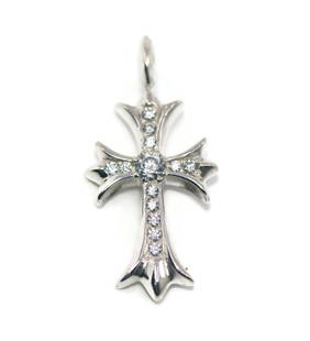 Chrome Hearts Cross Pendant Sterling Silver with Cubic Zirconia: Chrome Hearts Cross Pendant Sterling Silver with Cubic Zirconia This stunning cross pendant from Chrome Hearts is crafted from sterling silver and adorned with sparkling cubic zirconia. The pendant me