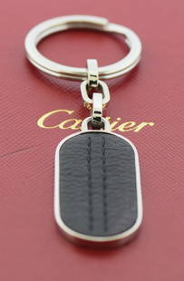 Cartier Stainless Steel Key Ring 41mm 100% Authentic with Box: Cartier Stainless Steel Key Ring 41mm 100% Authentic with Box This Cartier key ring is crafted from high-quality stainless steel, showcasing a sleek silver color that embodies elegance and durability.