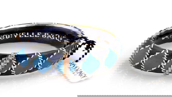 Nouvelle Bague 18k Yellow Gold Blue Enamel Diamond Bangle Bracelet: Nouvelle Bague 18k Yellow Gold Blue Enamel Diamond Bangle Bracelet This exquisite Nouvelle Bague bracelet is a luxurious blend of elegance and artistry. Crafted in Italy, it features a stunning blue e