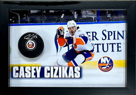 Casey Czikas Signed Islanders Custom Framed Puck Display 15.5 x 11: Casey Czikas Signed Islanders Custom Framed Puck Display 15.5 x 11 Showcase your love for hockey with this custom framed puck display featuring a signed puck by New York Islanders forward Casey Czikas