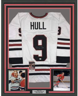 Framed Autographed Bobby Hull Chicago Blackhawks Jersey JSA COA 35x39: Framed Autographed Bobby Hull Chicago Blackhawks Jersey JSA COA 35x39 This framed autographed Chicago Blackhawks hockey jersey features the legendary Bobby Hull, a celebrated athlete in the NHL. The j